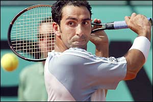 Defending champion Albert Costa plays a backhand return