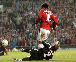 Manchester United's Ruud van Nistelrooy pulls a goal back against Real Madrid to make the score 1-1 
