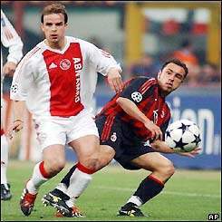 Cristian Brocchi (right) gets a shot past Ajax's Wesley Sneijder 