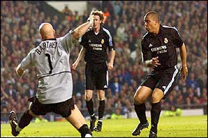 Real Madrid's Ronaldo scores his sides second goal past Manchester United's goalkeeper Fabien Barthez 