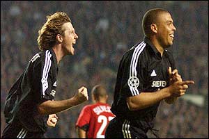 Real Madrid's Ronaldo celebrates scoring the second goal against Manchester United with Steve McManaman