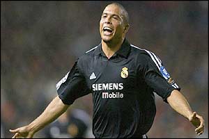 Real Madrid's Ronaldo celebrates after scoring his third goal against Manchester United