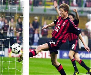 Jon Dahl Tomasson scores for AC Milan