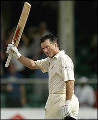 Steve Waugh celebrates making his 30th Test century in the third Test against the West Indies