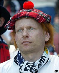A German fan wears Scottish fancy dress