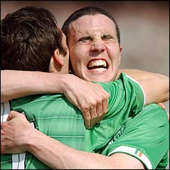 John O'Shea embraces Gary Breen