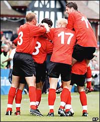 Ervin Skela is mobbed by his team-mates after scoring for Albania