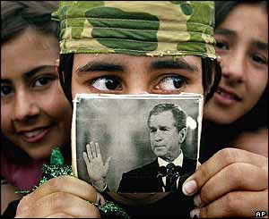 Kirkuk girl shows a picture of George Bush