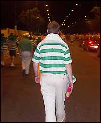 Daniel O'Sullian sets off home after Celtic's defeat in the Uefa Cup final
