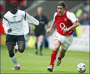 Bolton's Bernard Mendy chases Arsenal's Robert Pires