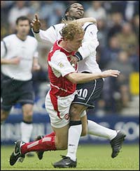 Arsenal midfielder Ray Parlour tackles Bolton playmaker Jay-Jay Okocha
