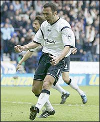 Youri Djorkaeff celebrates scoring Bolton's first goal after 74 minutes