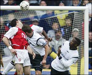 Arsenal centre-back Martin Keown heads into his own net to bring the scores level at 2-2