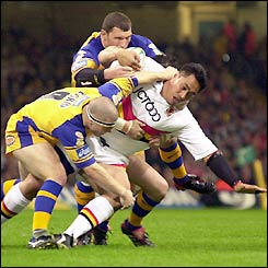 Bradford Bulls' Joe Vagana is pinned down by the Leeds defence