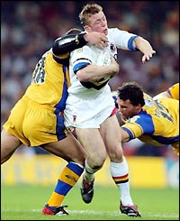 Bradford Bulls' Mike Forshaw charge is ended by the Leeds defence