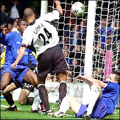 Alain Goma scores an own-goal against Chelsea