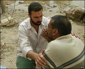 Two Iraqi men at the site of the explosion