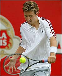 Bogdanovic plays a backhand to Parmar