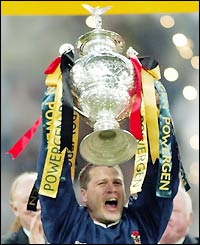 Bradford skipper James Lowes holds the Challenge Cup aloft