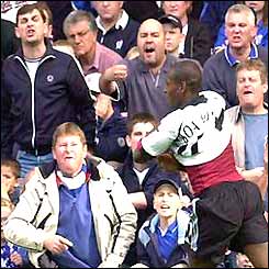 Luis Boa Morte celebrates his goal in front of disgruntled Chelsea fans
