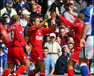 Michael Owen celebrates with Danny Murphy and Steven Gerrard after scoring against Everton on 15 September 2001