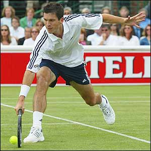 Tim Henman in action against Italy's Davide Sanguinetti