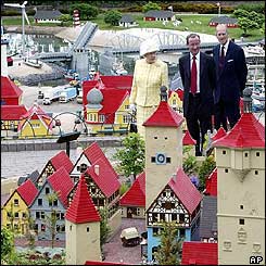 The Queen, Lego president Kjeld Kirk Kristiansen and the Duke of Edinburgh looking at Lego models of Danish housing