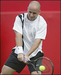Andre Agassi in action against Australian Peter Luczak