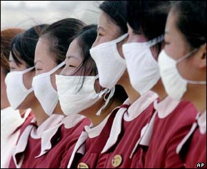 Masked restaurant workers in Beijing