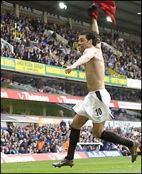 Ruud van Nistelrooy takes off his shirt in celebration after scoring against Spurs