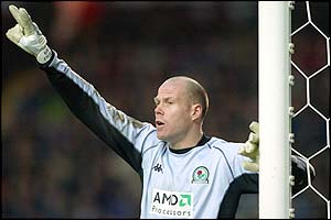 Blackburn goalkeeper Brad Friedel issues instructions to his team-mates