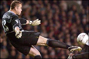 Leeds goalkeeper Paul Robinson clears the ball 
