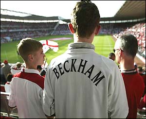 An England fan wear's a 'Beckham' jacket at the Riverside Stadium