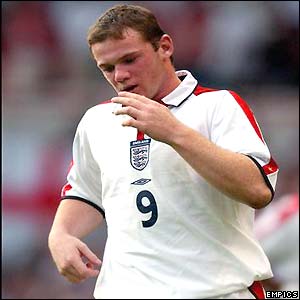 Wayne Rooney looks dejected as he is substituted