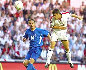 Michael Owen rises to head home his second goal