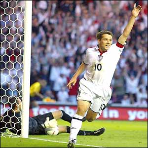 Michael Owen celebrates scoring his second goal