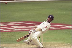 Michael Vaughan dodges a bouncer from South Africa's Shaun Pollock