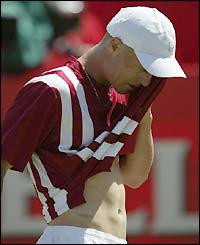 Defending champion Hewitt crashes out at Queen's