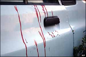 Blood is seen on the side of a car after a clash between Iranian protesters and hard-line vigilantes 