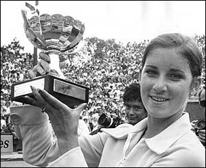 American tennis player Chris Evert holds the trophy after winning the women's title at the 1974 French Open in Paris