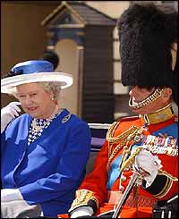 Queen and Duke of Edinburgh leaving Buckingham Palace in a carriage