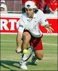 Grosjean plays a low volley