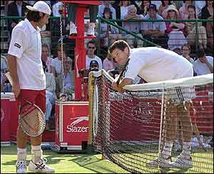 Grosjean apologises to Henman after hitting him with a volley