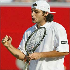 Grosjean celebrates his win over Henman