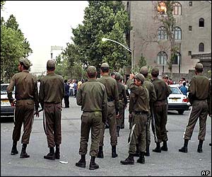 Police block a road in Tehran