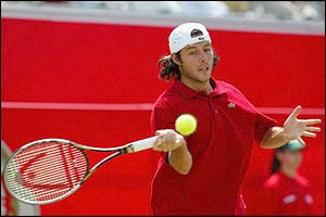 Grosjean manages to get a racquet to Roddick's serve