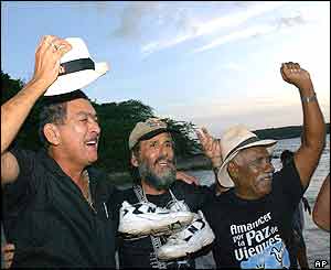 Protesters land on beach once occupied by US navy 