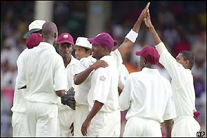 The Windies team celebrate Ponting's dismissal