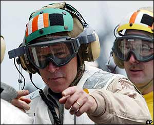 President Bush (R) in cranial protector and goggles