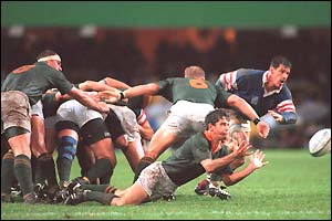 South Africa's Joost van der Westhuizen gets the ball out to his backs in their last-four meeting against France
